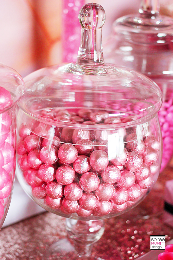 Pink bulk candy in apothecary jars
